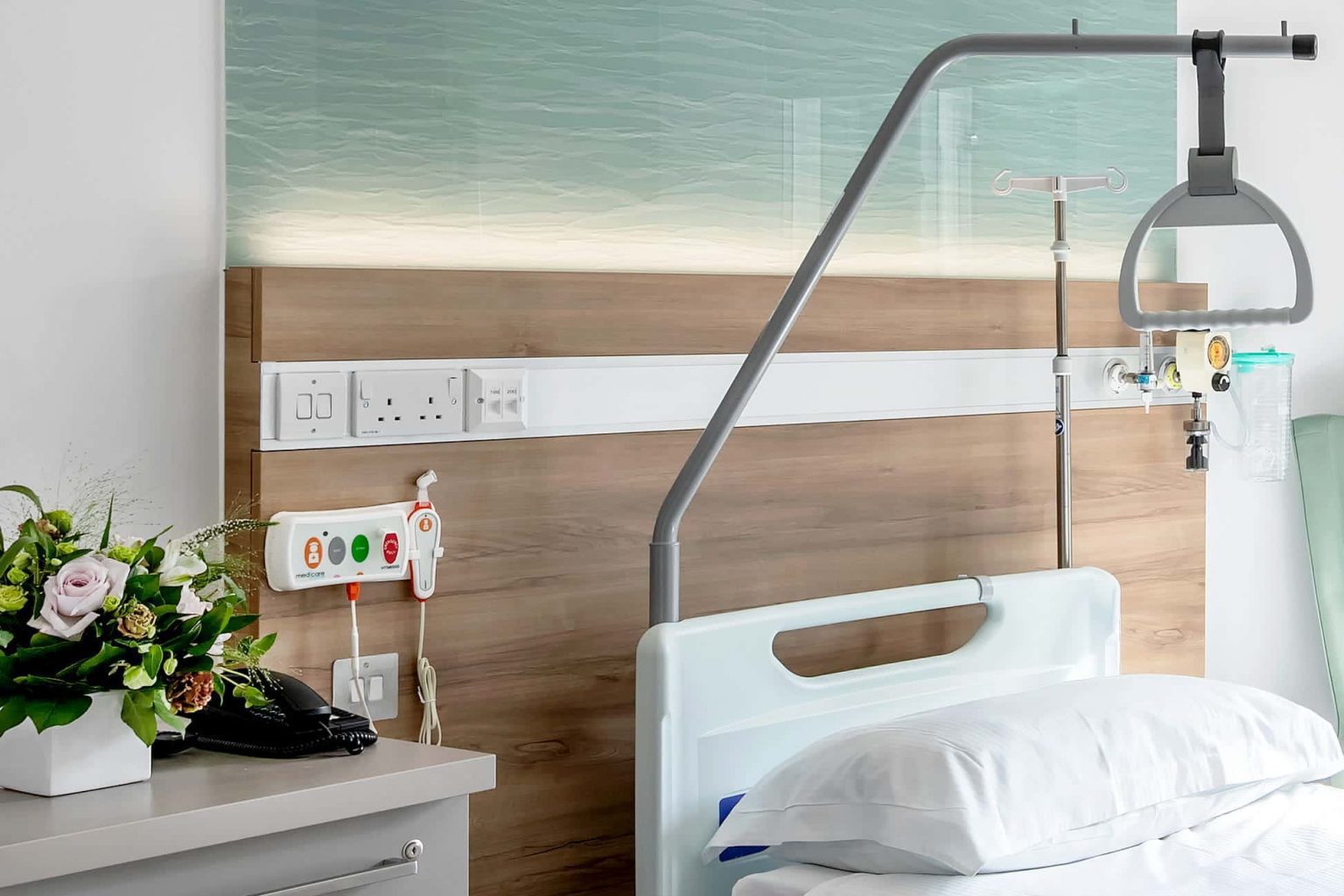 Hospital patient room showing a Medicare nurse call system unit installed at St John & St Elizabeth, London