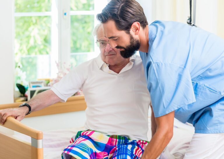 Healthcare worker assisting an elderly patient
